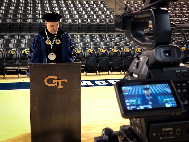 A photo of President Cabrera delivering his virtual commencement address in an empty McCamish Pavilion.