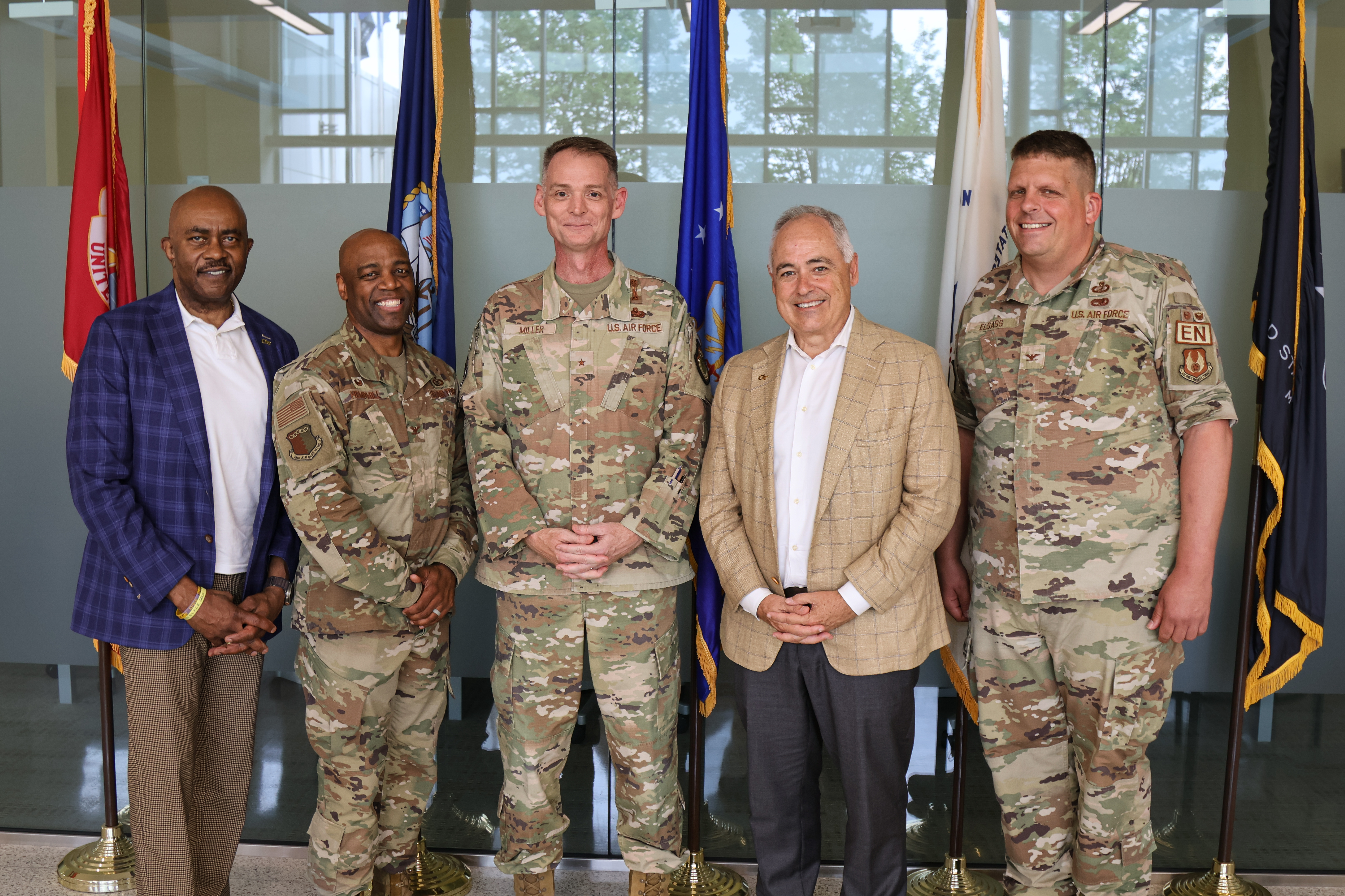 President Cabrera and Georgia Tech Chief of Staff with military service members.