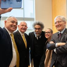 Ángel Cabrera, Sonny Perdue, Cornel West, Amanda Murdie, and Robert George pose for a selfie
